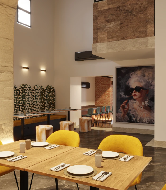 Interior moderno con mesa de madera y sillas amarillas, pared de ladrillo.